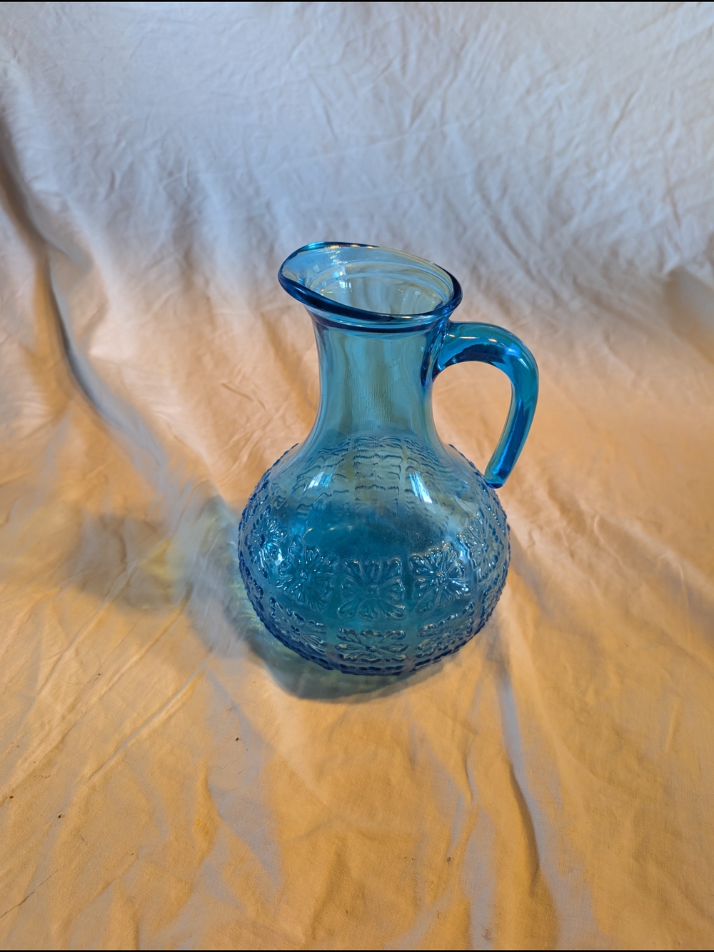 2/60$ Vintage Italy Blue Glass Pitcher with Embossed Floral Pattern